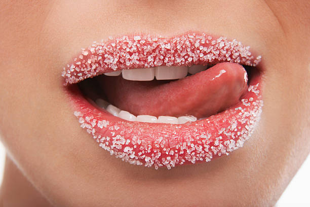 istock Woman Licking Lips Covered With Sugar 461936811