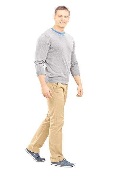 istock Confident casual guy walking and looking at camera 461942085