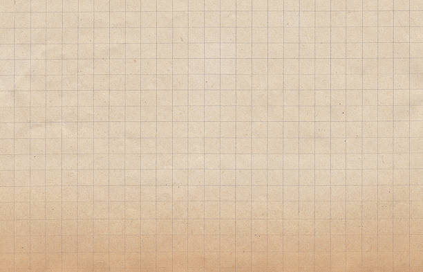 istock piece of beige brown old discolored grid paper 461943147