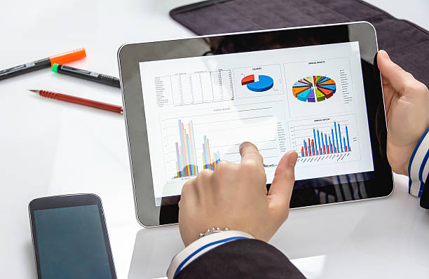 istock Businesswoman showing documents in digital tablet 461943307