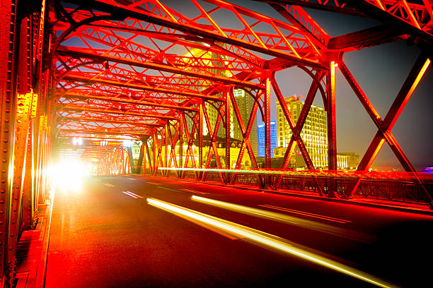 istock night traffic lights inside of steel bridge 461952163