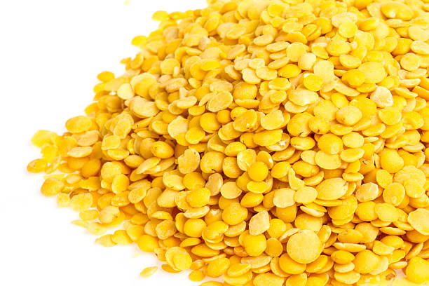 istock Yellow lentils isolated on white background. Macro shot 461953629