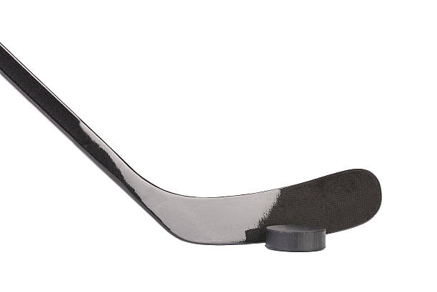 istock Black ice hockey stick and puck. 461954503