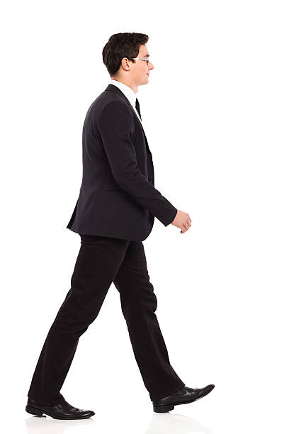 istock Walking businessman in black suit. 461957359