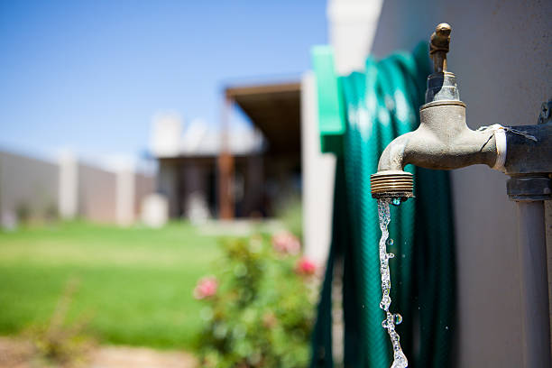 istock Garden tap with running water 461960795