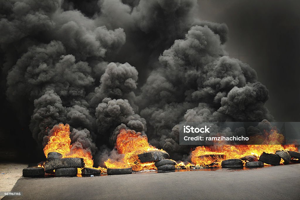 Burning tires causing toxic pollution Smoke - Physical Structure Stock Photo