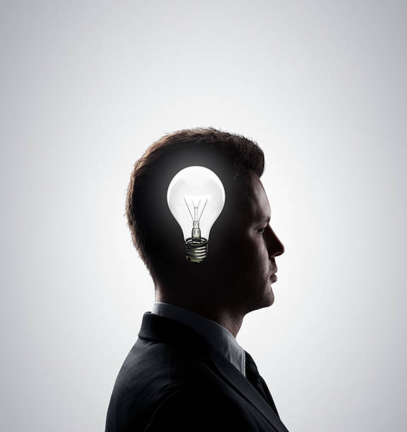 istock businessman with lamp 461962337