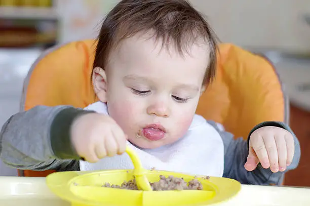 Photo of baby eats buckwheat groats