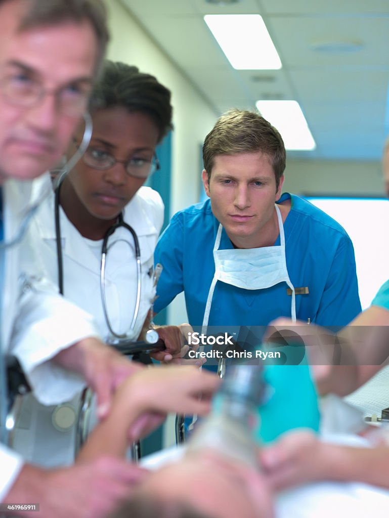 Doctor Rushing Patient In Doctors And Nurses Rushing With Patient In Hospital Stock Photo ...