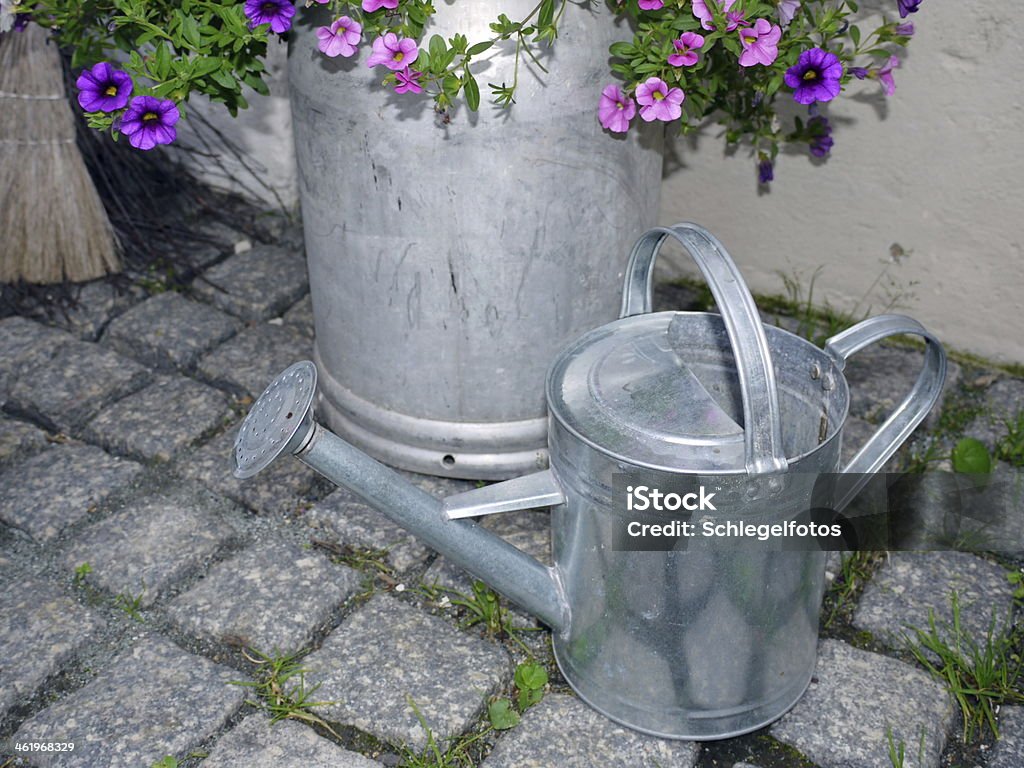 watering can zink watering can zink background Blossom Stock Photo