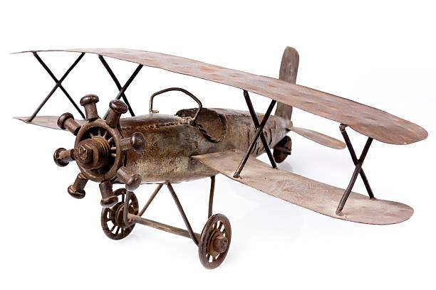 istock Old metal airplane toy  on white 461972799