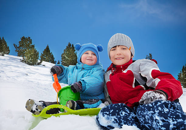 istock Two brothers having fun on winter day 461979839