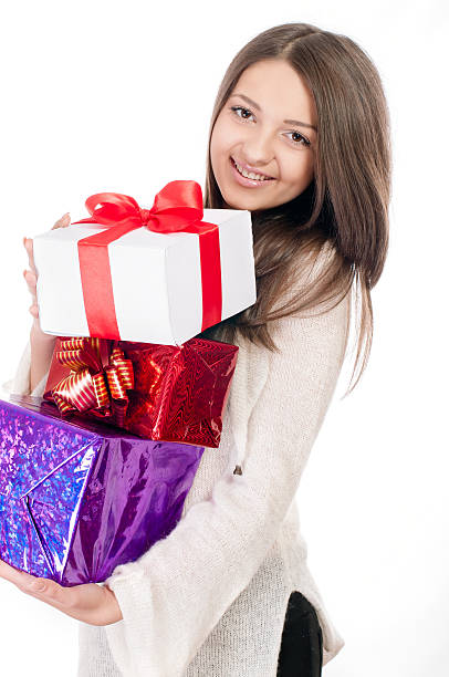 istock Beautiful young girl with gift in hand 461983329
