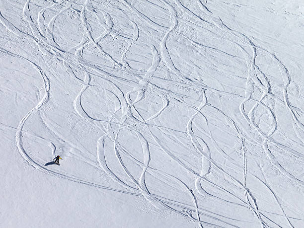 istock Snowboarder downhill on off piste slope with newly-fallen snow 461988833