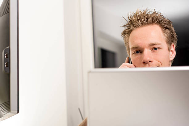 istock Businessman with telephone in office 461989431