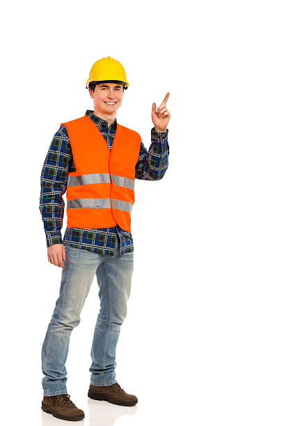 engenheiro a apontar. - manual worker full length isolated on white standing imagens e fotografias de stock