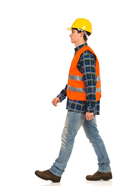 walking bauarbeiter. - construction worker building contractor craftsperson full length stock-fotos und bilder