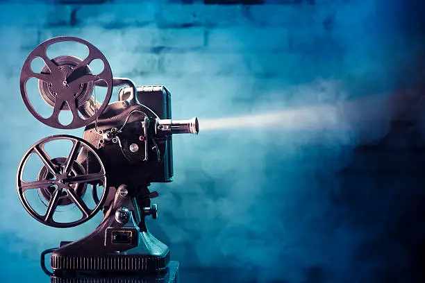 Old film projector with dramatic lighting