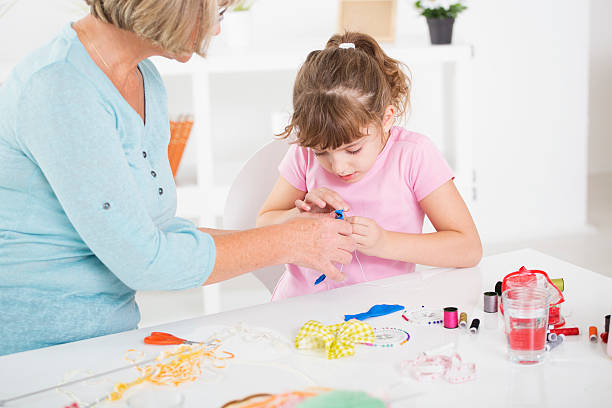 istock Grandmother and granddaughter sewing. 462001601