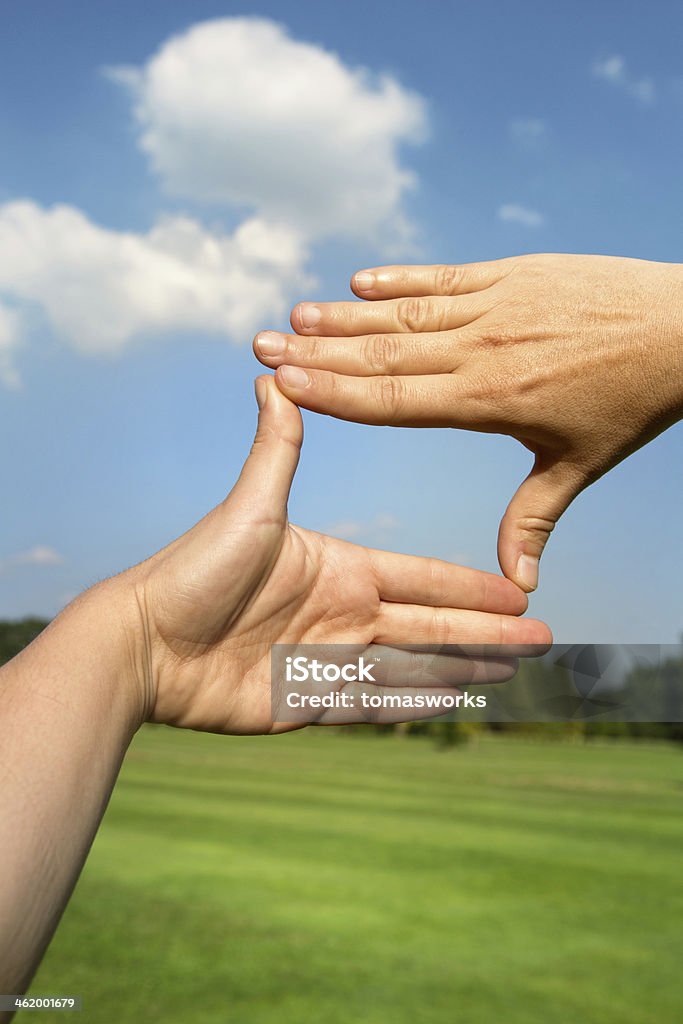 Framing with hands Framing with hands, nature in background Backgrounds Stock Photo