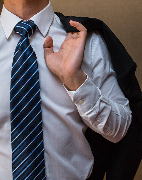 istock Businessman stands with jacket over his shoulder. 462002723