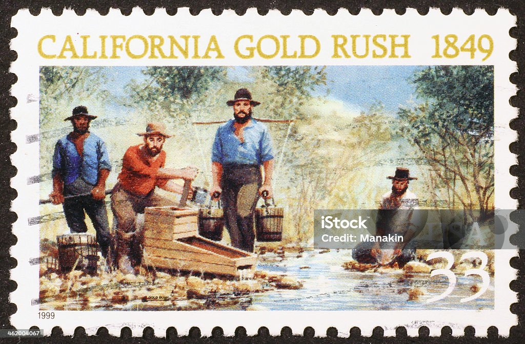 California gold rush on a stamp A scene of miners looking for gold in a torrent reproducted in a stamp Gold - Metal Stock Photo