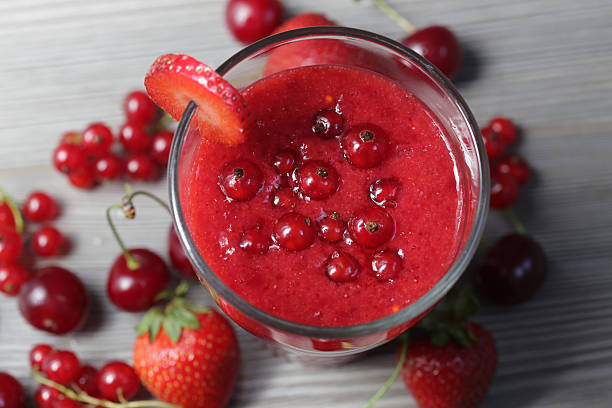 Red smoothie with strawberry cherry and currant