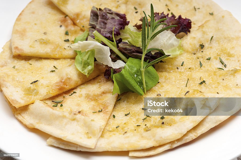 garlic pita bread pizza with salad on top fresh healthy garlic pita bread pizza with salad on top Appetizer Stock Photo