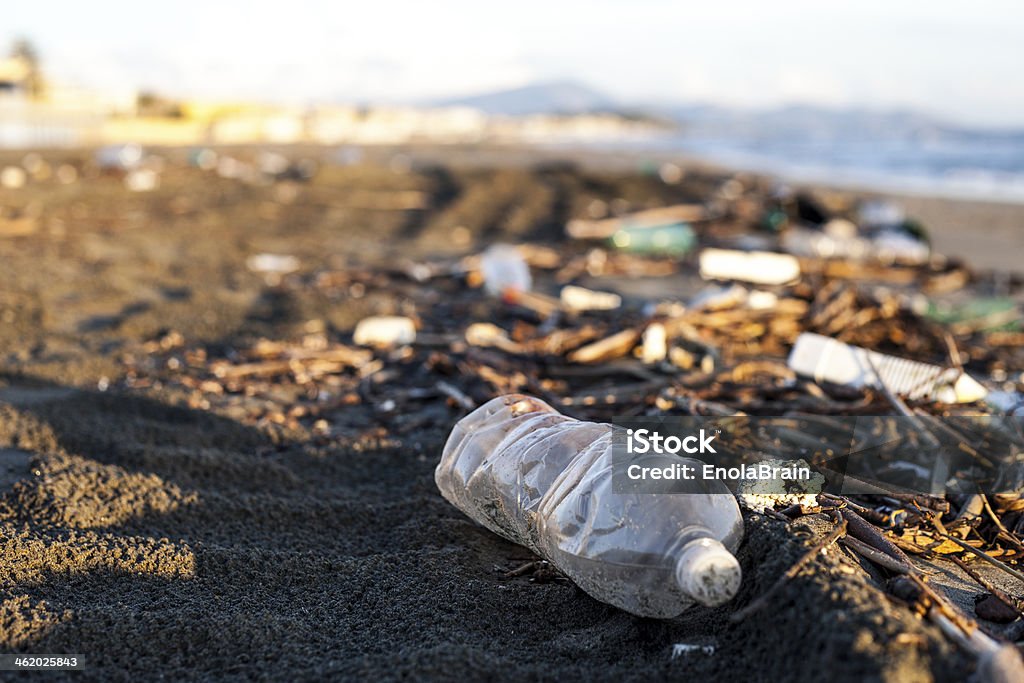 pollution, plastic water bottle on a beach Plastic Stock Photo