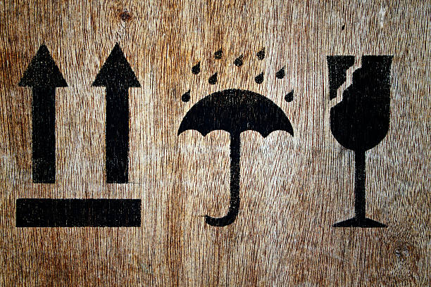 close-up black fragile symbol on wood