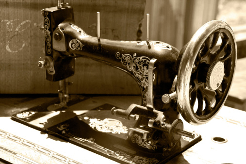 an old sewing machine in sepia