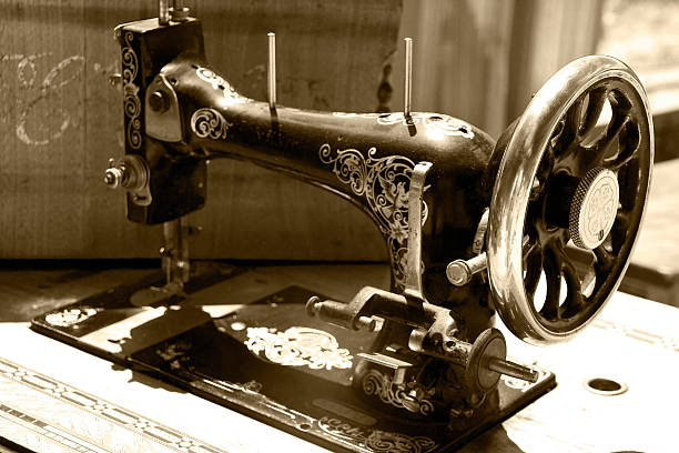 old sewing machine in sepia stock photo