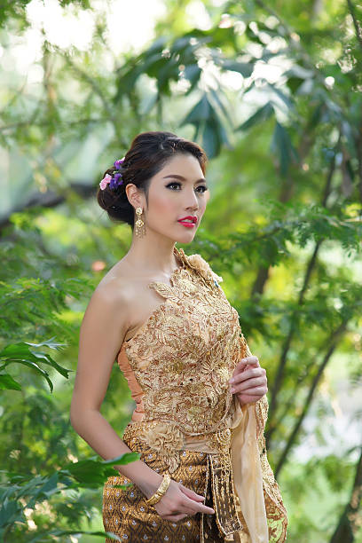 istock Younf woman wearing typical Thai dress 462037647
