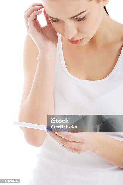 Sad Worried Woman Holding Pregnancy Test Stock Photo - Download Image Now - 20-29 Years, Adult, Adults Only