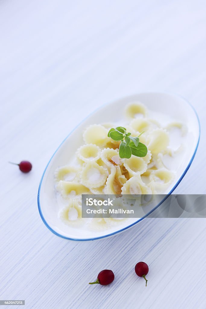 Pasta with milk Pasta with milk and berry jam on the table Berry Stock Photo