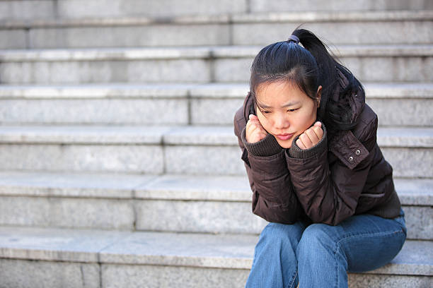 istock woman sit on stairs 462047505