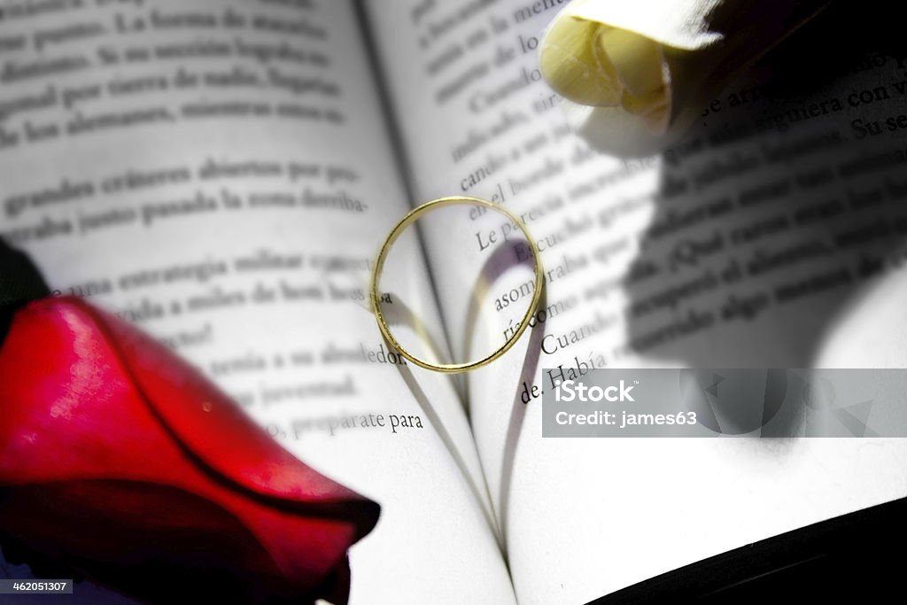 gold ring and book a romantic heart forming Adult Stock Photo