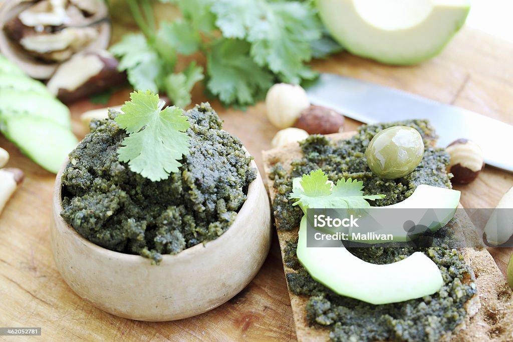 sandwiches with avocado spicy pate of crushed nuts and fresh coriander Appetizer Stock Photo