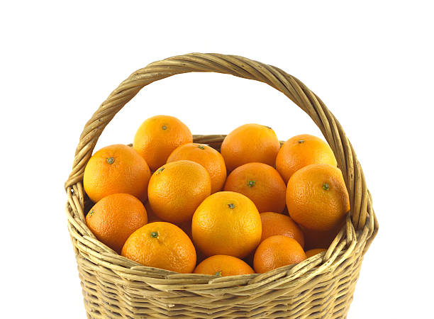 istock Tangerines in brown wicker basket isolated 462053633
