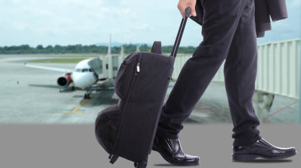 istock business travellers walking over the sea 462055397