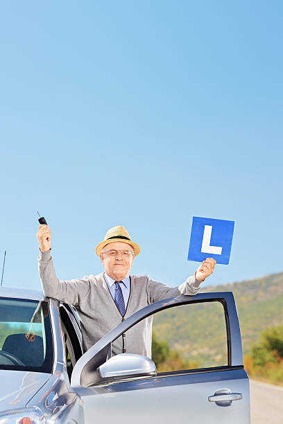 istock Happy mature man after having his driver's licence 462064021