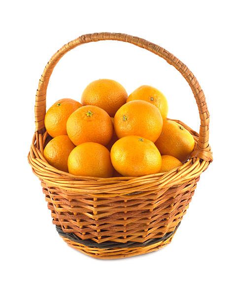 istock Tangerines in brown wicker basket isolated 462067601