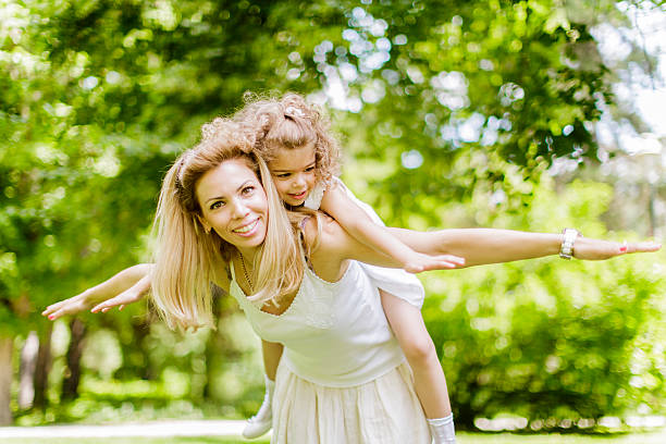 istock Mother and daughter in the park 462069985