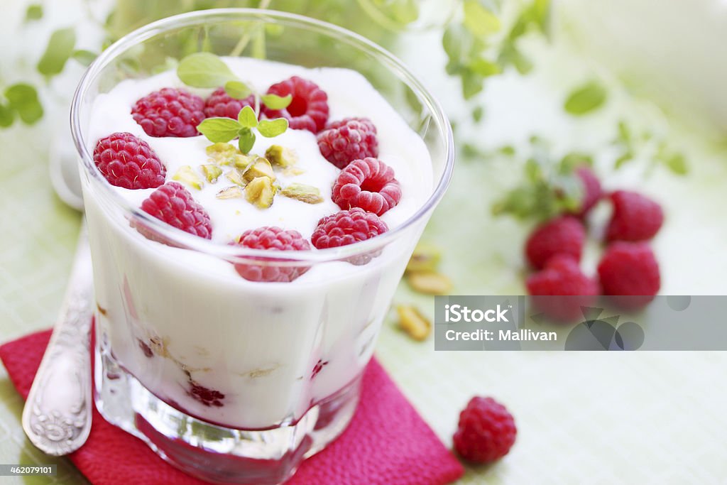 dessert with berries Delicious dessert with fresh raspberries and pistachios Baking Stock Photo