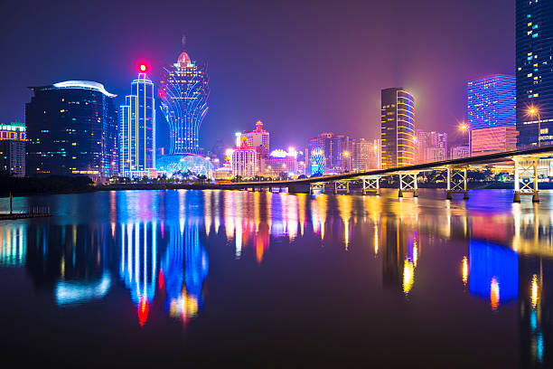 night skyline of macau viewed from the water - macao bildbanksfoton och bilder