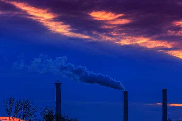 istock Heavy smoke spewed from coal powered plant 462083611