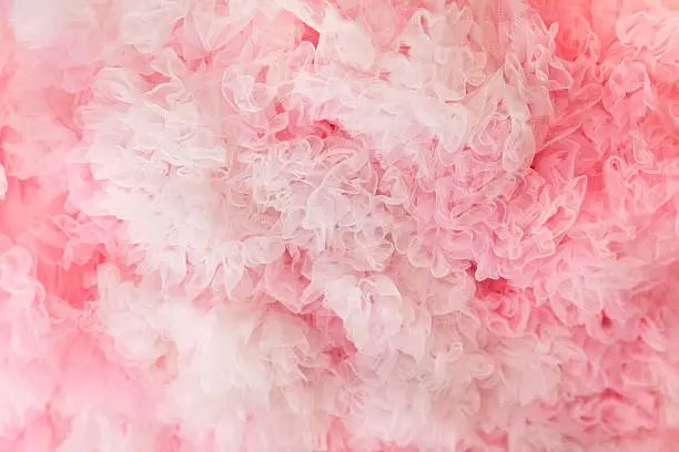 Pink and white tulle fabric background.