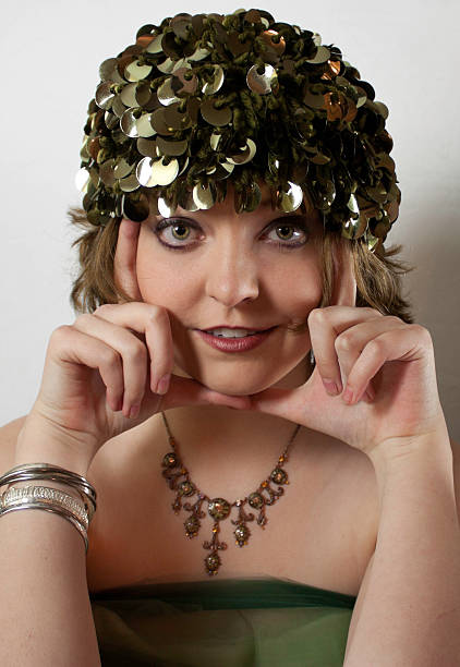 Young woman wearing vintage green hat.