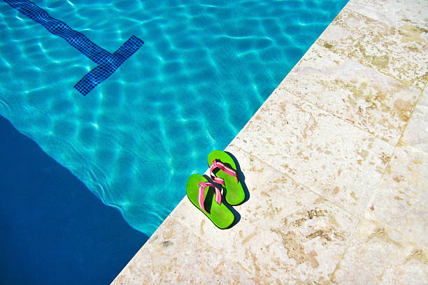 istock Slippers near swimming pool 462086457