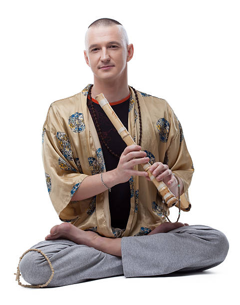 yoga guru jugando acanaladuras, aislado en blanco - male vertical photography studio shot fotografías e imágenes de stock